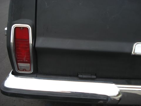 1977 Jeep Cherokee - Rear view of a 1977 Jeep Cherokee, its taillight and chrome bumper.