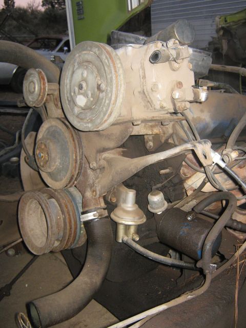 1972 Ford F-250 - Close-up view of an engine motor assembly with various components attached.