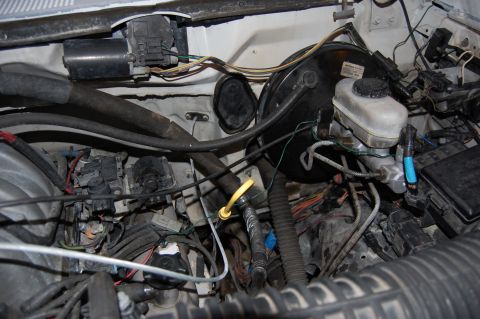 1994 Ford Bronco - Close-up view of the engine bay, showing the brake system components and wiring harness.