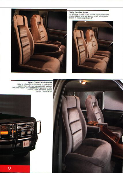 1996 Ford C-350 (Centurion Conversions) - The interior features plush captain's chairs with adjustable headrests and a center console with storage.