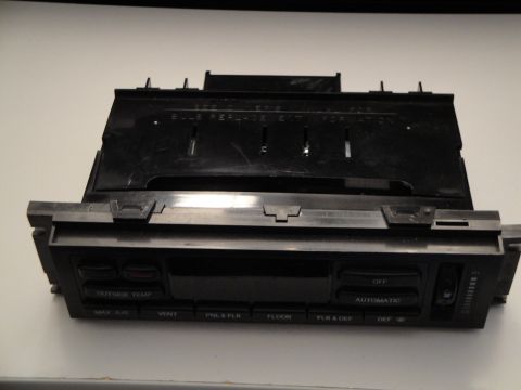 1993 Ford Taurus - This is a car's climate control unit, showing various function buttons and a temperature display area.