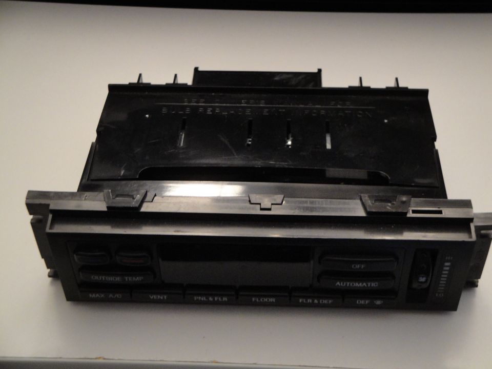 Car climate control unit with buttons for MAX A/C, VENT, PNL & FLR, FLOOR, FLR & DEF, DEF, OFF, and AUTOMATIC