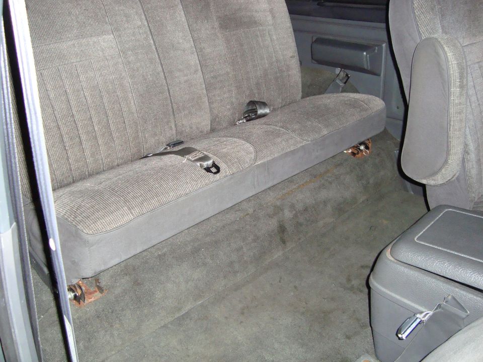 Interior rear bench seat with seatbelts