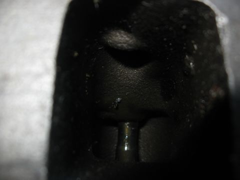 1981 Ford Bronco - Close-up of a dark engine component with a visible metal pin.