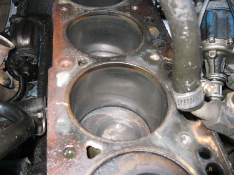 1981 Ford Bronco - Close-up of an engine block's cylinders, revealing internal wear and signs of use.