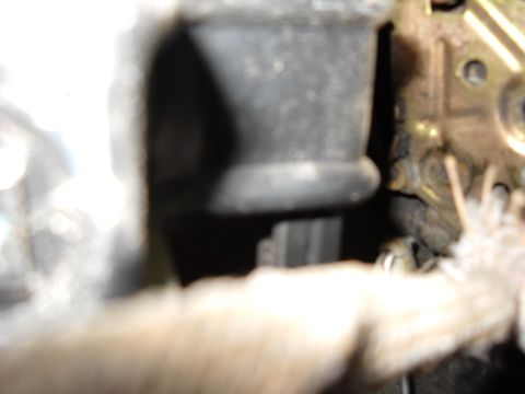 1993 Ford C-150 (Centurion Conversions) - The internal workings of a car door lock are visible in this close-up shot.