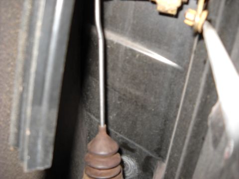 1993 Ford C-150 (Centurion Conversions) - Detail of a door lock actuator rod, showing the connection to the mechanism.
