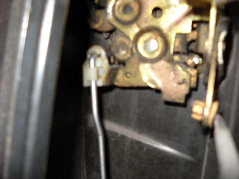1993 Ford C-150 (Centurion Conversions) - Close-up of a vehicle's internal door lock assembly.