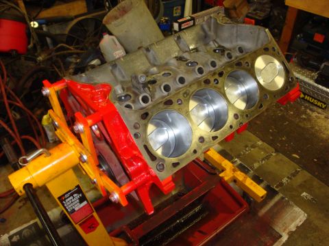 1989 Ford Bronco - Engine block on a stand, showing pistons and cylinder bores.