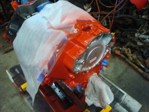 1989 Ford Bronco - An engine block is being prepped for painting, with protective coverings in place.
