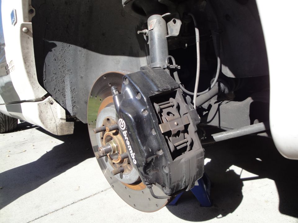 Black Brembo brake caliper and rotor on a vehicle