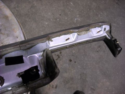 1993 Ford C-150 (Centurion Conversions) - Close-up view of a detached interior trim piece, showing its construction and mounting hardware.
