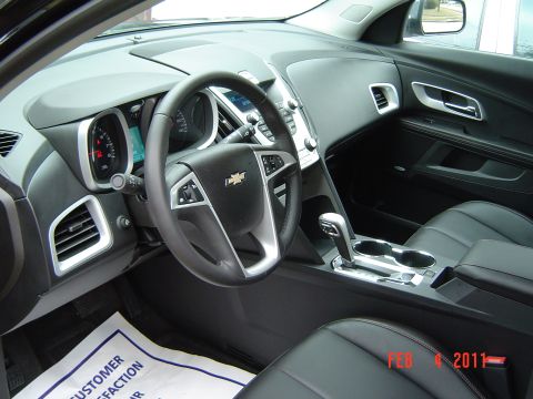 2011 Chevrolet Equinox - Interior view of a 2011 Chevrolet Equinox, showing the dashboard and seating.