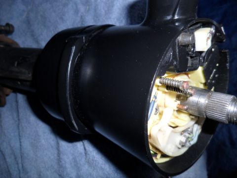1973 Ford Ranchero - Close-up view of a vehicle's steering column assembly, showing internal wiring and mechanical parts.