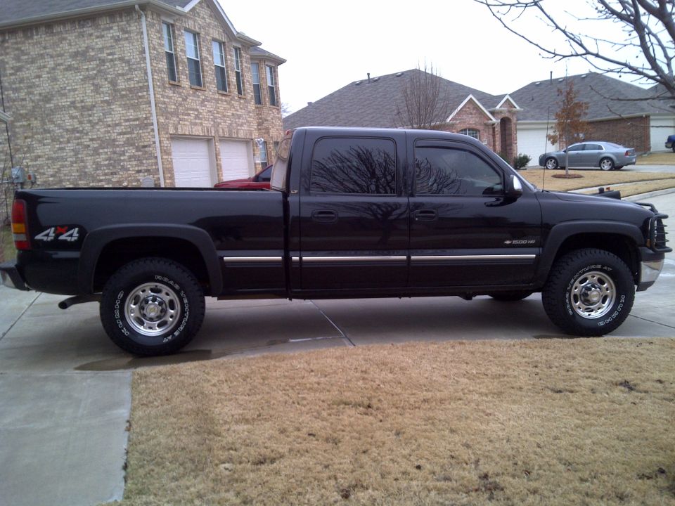 Black 2002 Chevrolet Silverado 1500 crew cab pickup truck, side view