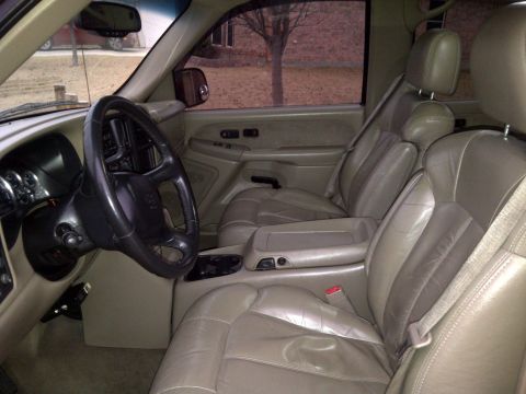 2002 Chevrolet Silverado 1500 - Interior view of a 2002 Chevrolet Silverado 1500, highlighting the tan leather seats and dashboard details.