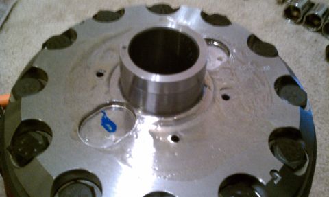 1990 Ford Bronco - A close-up view of a metal differential cover, showing its bolt holes and central hub. The registry claims it is from a 1990 Ford Bronco, b…