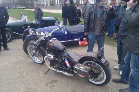 1991 Ford LTD Crown Victoria - A custom motorcycle is parked next to two vintage cars.
