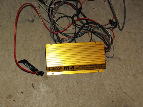1994 Ford Bronco - Crane Cams HI-6 ignition box and its associated wiring harness are shown on a concrete surface.