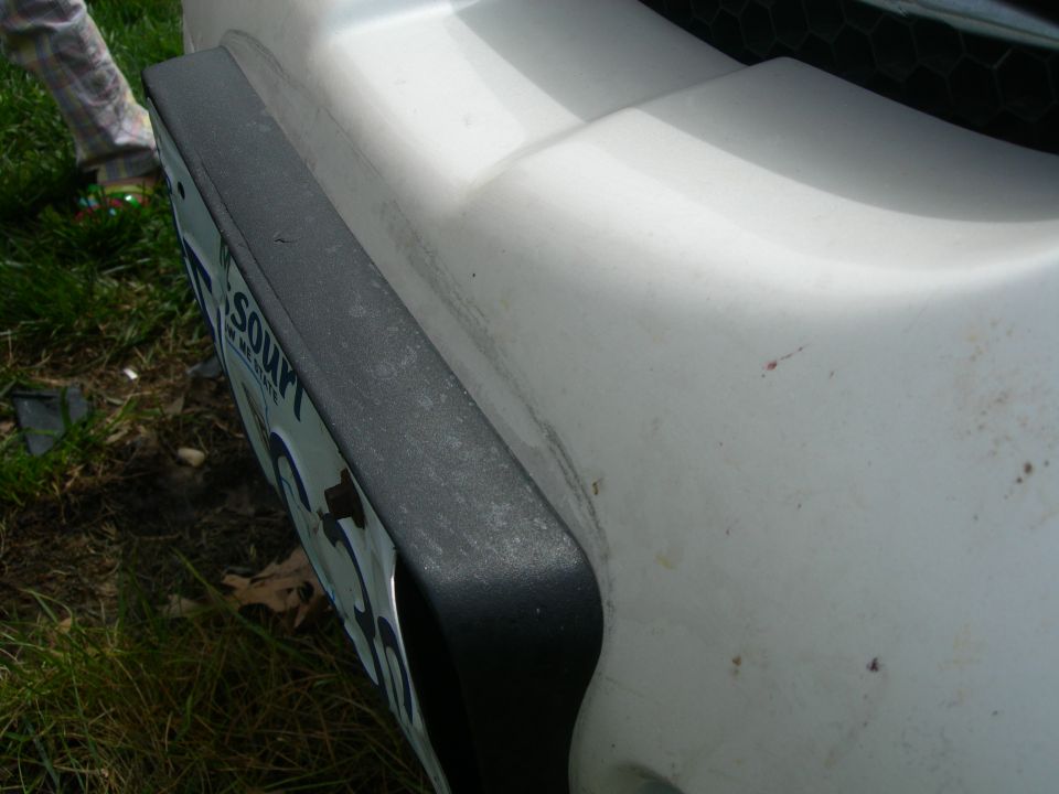 Deflection in the bumper from the hit.  Really screwed up my 200k mile paint.