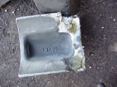 1992 Ford Bronco - A close-up view of a gray metal component with embossed identification numbers.