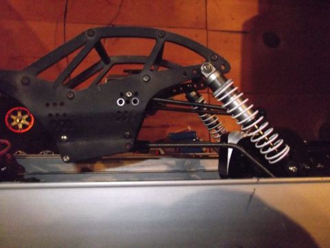 1989 Ford Bronco - Close-up of a remote control car's suspension and chassis components.