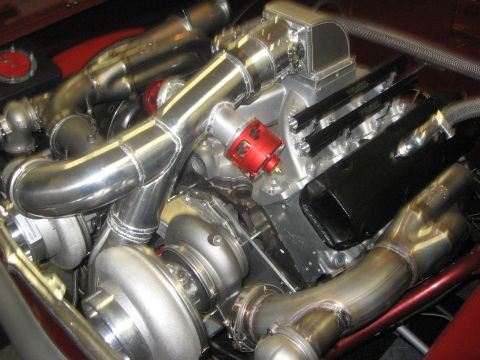 1965 Ford Fairlane - This custom engine build features a complex twin-turbo setup with polished stainless steel exhaust and intake plumbing.