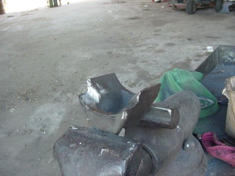 1992 Ford Bronco - Metal fabrication in progress: a part is held securely in a heavy-duty vise.