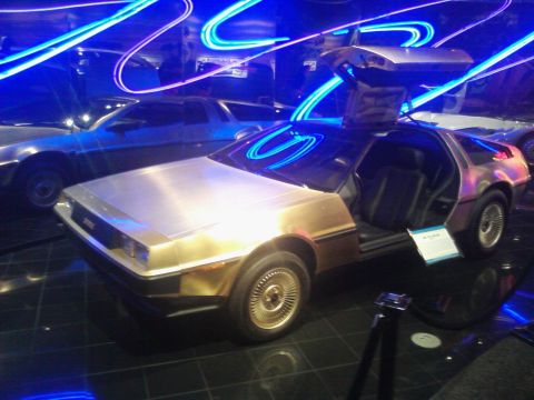 1995 Ford Taurus - DeLorean DMC-12 on display at a museum, with another DeLorean visible in the background.