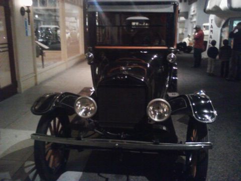 1995 Ford Taurus - This antique car is on display at a museum, not a 1995 Ford Taurus.