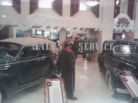 1995 Ford Taurus - A museum exhibit depicts a vintage Ford dealership interior with classic cars and mannequins.
