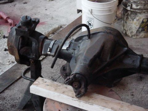 1992 Ford Bronco - A rear axle assembly is shown mounted on a stand, likely for repair or inspection.
