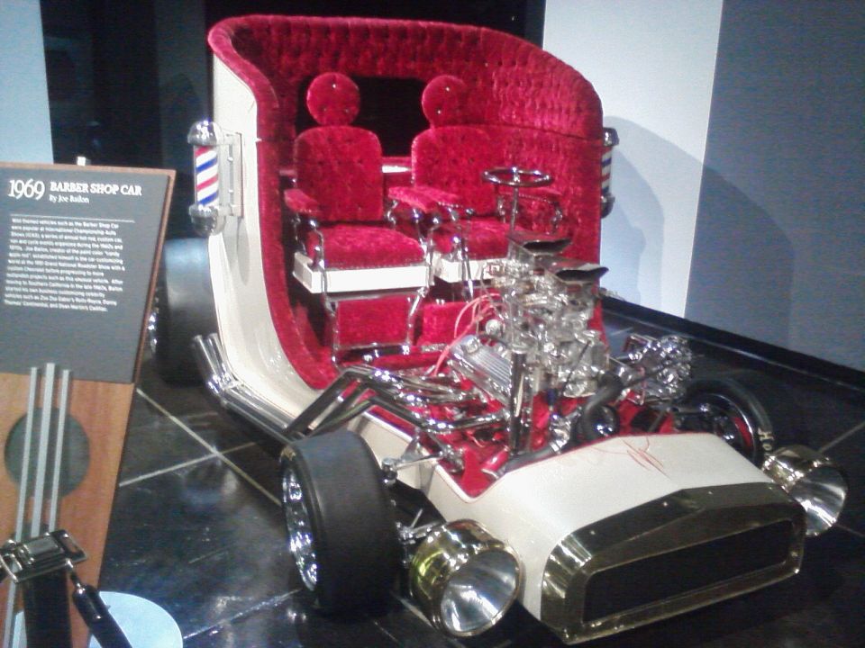 1969 Barber Shop Car with red velvet interior and exposed V8 engine