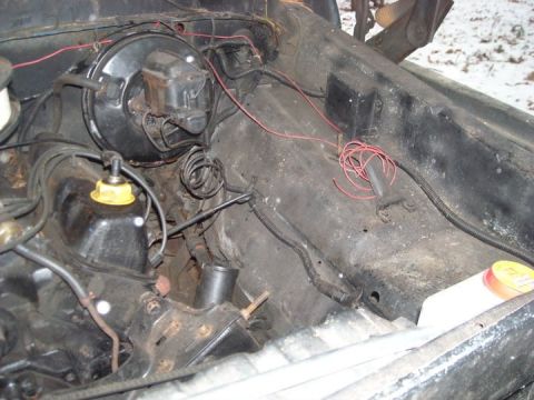 1979 Ford Bronco - Close-up view of the engine compartment, showing various mechanical components and wiring harnesses.