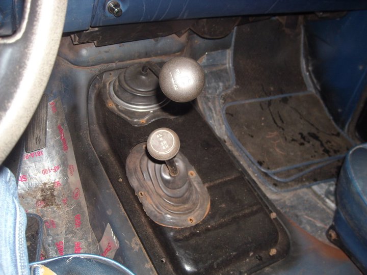 Interior view of 1979 Ford Bronco's dual gear shifters and dashboard