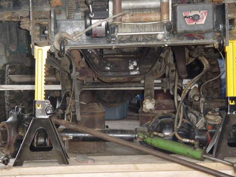 1992 Ford Bronco - Close-up view of a vehicle's undercarriage, showing suspension and a winch system.