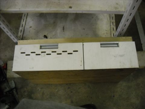1979 Ford F-150 - White storage drawers with silver handles and ventilation slots are seen on a wooden base.