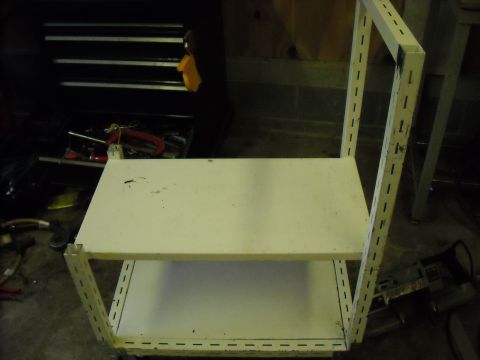 1979 Ford F-150 - A two-shelf metal storage unit is shown in a workshop environment.