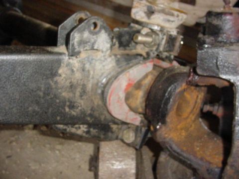 1992 Ford Bronco - Close-up view of heavily used and corroded vehicle suspension components.