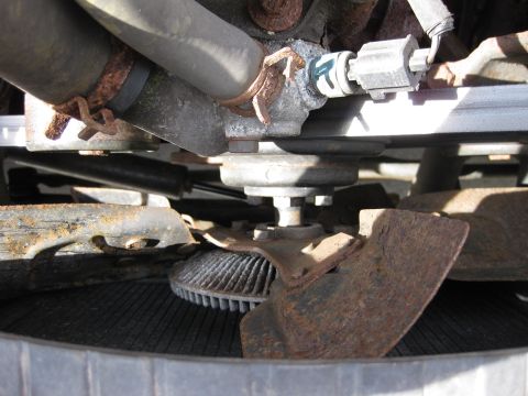 1998 Jeep Wrangler - Close-up of a vehicle's engine fan and radiator, showing signs of rust and wear.