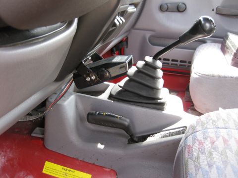 1998 Jeep Wrangler - Interior view of a Jeep Wrangler showing the manual transmission and transfer case controls, with a brake controller installed.