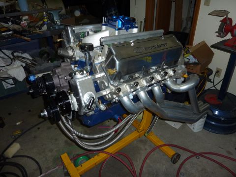 1971 Ford Mustang - Custom Ford V8 engine assembly with Motorsport valve covers and headers on an engine stand.