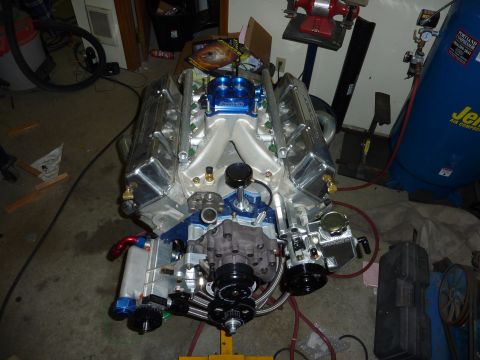 1971 Ford Mustang - A custom V8 engine assembly is shown, chrome valve covers and a blue intake manifold.