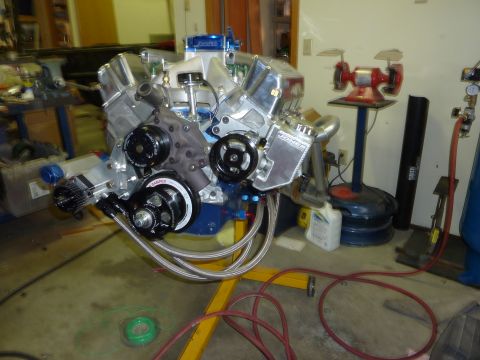 1971 Ford Mustang - A custom V8 engine, likely for a performance application, is displayed on a stand in a workshop setting.