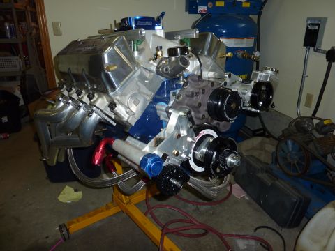 1971 Ford Mustang - Custom V8 engine assembly with supercharger and headers mounted on an engine stand.