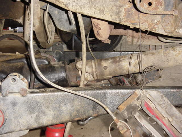 Close-up of a vehicle's driveshaft and differential assembly
