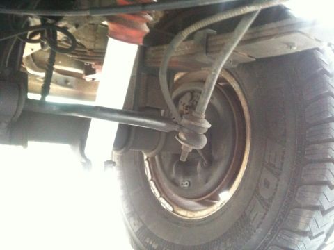 1995 Ford Bronco - Close-up view of the underbody suspension components and tire, with a watermark visible at the bottom.