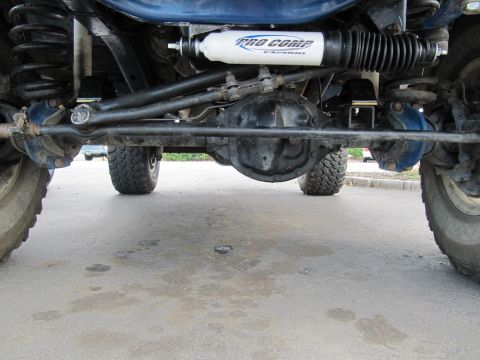 1970 Ford Bronco - The underside of a 4x4 vehicle shows its suspension and steering components, including a Pro Comp shock absorber.