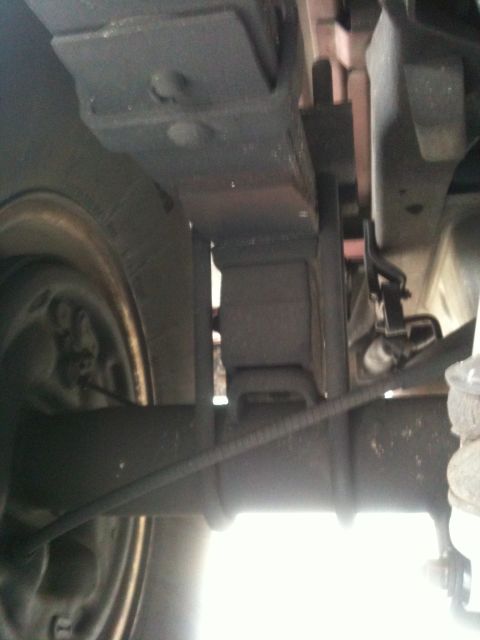 1995 Ford Bronco - Close-up view of the underbody suspension system, showing leaf springs and axle components.