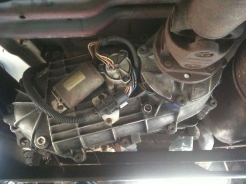 1995 Ford Bronco - The photo shows the transfer case and driveshaft assembly of a vehicle, not the underbody of a 1995 Ford Bronco.